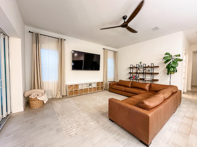 9865 SW Meridian Way, Stuart, FL 34997 - living area featuring ceiling fan and wood finished floors