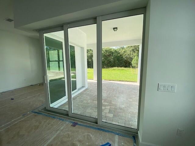 9865 SW Meridian Way, Stuart, FL 34997 - doorway with healthy amount of natural light