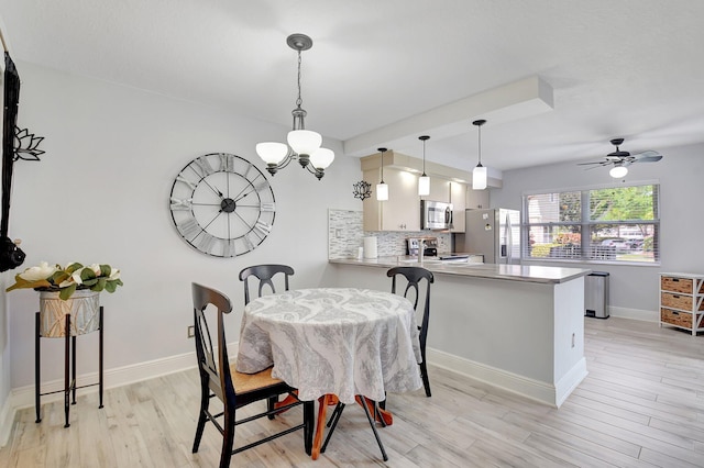 5201 Wheatley Ct, Boynton Beach, FL 33436 - dining room featuring light wood-style floors, baseboards, a chandelier, and ceiling fan