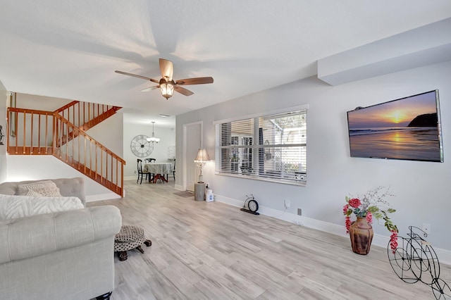 5201 Wheatley Ct, Boynton Beach, FL 33436 - living area featuring ceiling fan, a chandelier, stairs, and baseboards