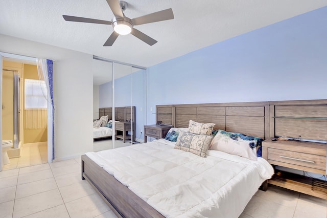 5201 Wheatley Ct, Boynton Beach, FL 33436 - tiled bedroom featuring a closet, a ceiling fan, ensuite bath, and baseboards
