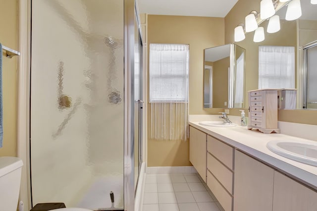 5201 Wheatley Ct, Boynton Beach, FL 33436 - bathroom featuring a shower stall, tile patterned floors, double vanity, toilet, and baseboards