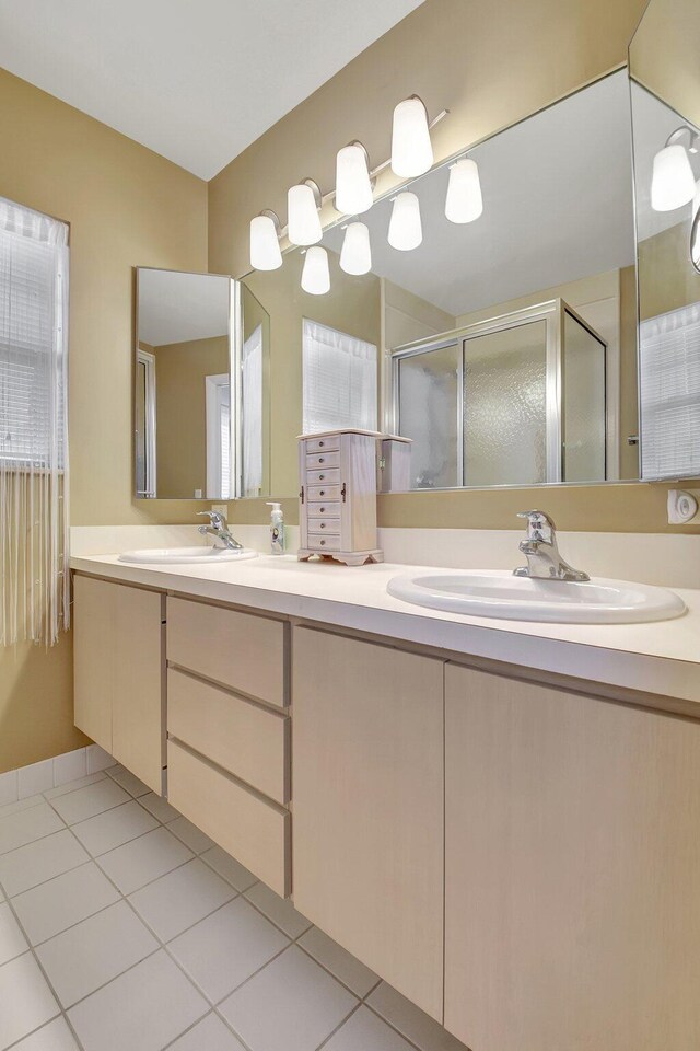 5201 Wheatley Ct, Boynton Beach, FL 33436 - bathroom featuring double vanity, a stall shower, and tile patterned floors