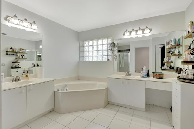 22831 Royal Crown Ter, Boca Raton, FL 33433 - full bathroom featuring a garden tub, two vanities, and tile patterned flooring