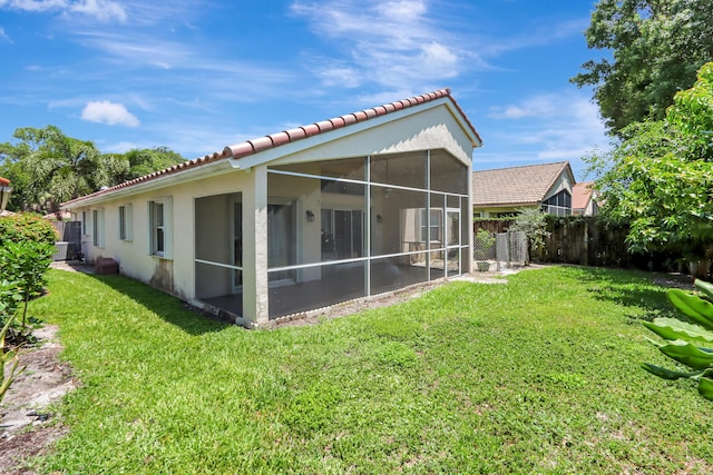 22831 Royal Crown Ter, Boca Raton, FL 33433 - back of property featuring a tile roof, a sunroom, and stucco siding