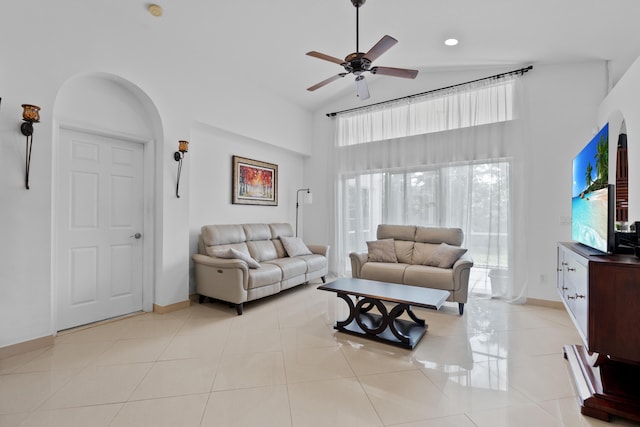 22831 Royal Crown Ter, Boca Raton, FL 33433 - living area with a high ceiling, a ceiling fan, arched walkways, baseboards, and light tile patterned floors