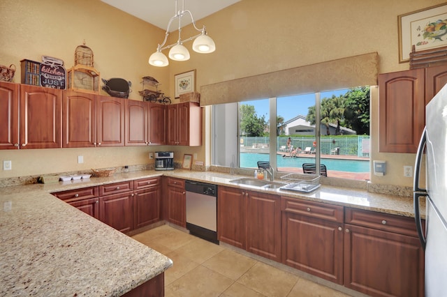 22831 Royal Crown Ter, Boca Raton, FL 33433 - kitchen with appliances with stainless steel finishes, light tile patterned floors, a towering ceiling, pendant lighting, and light stone counters