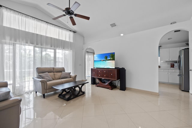 22831 Royal Crown Ter, Boca Raton, FL 33433 - living area with arched walkways, a ceiling fan, high vaulted ceiling, and light tile patterned flooring