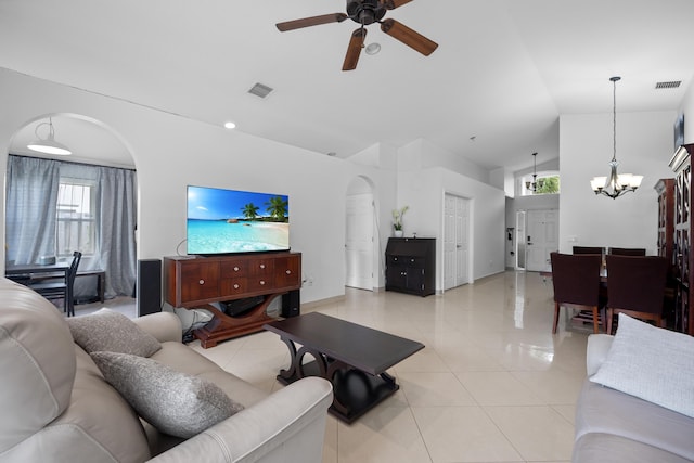22831 Royal Crown Ter, Boca Raton, FL 33433 - living room featuring a chandelier, a ceiling fan, high vaulted ceiling, light tile patterned floors, and baseboards