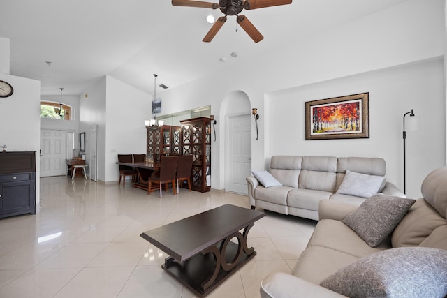 22831 Royal Crown Ter, Boca Raton, FL 33433 - living area featuring ceiling fan, arched walkways, light tile patterned floors, high vaulted ceiling, and baseboards