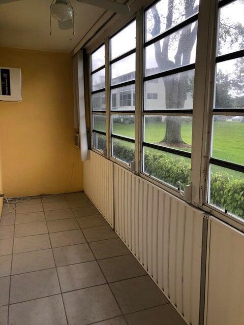 261 Suffolk Unit G, Boca Raton, FL 33434 - unfurnished sunroom featuring healthy amount of natural light