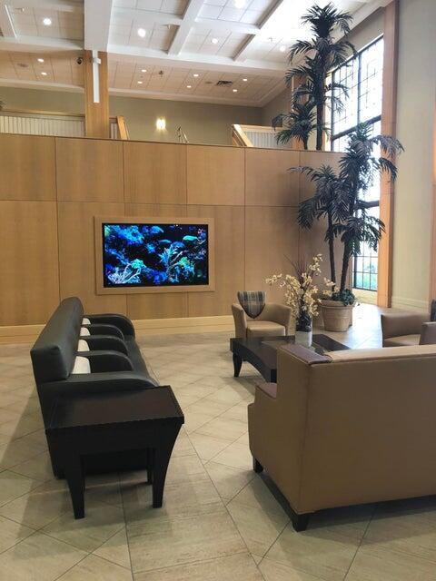 261 Suffolk Unit G, Boca Raton, FL 33434 - lobby with a high ceiling, beam ceiling, coffered ceiling, and recessed lighting
