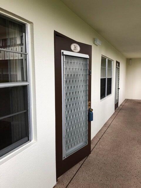 261 Suffolk Unit G, Boca Raton, FL 33434 - view of exterior entry with stucco siding