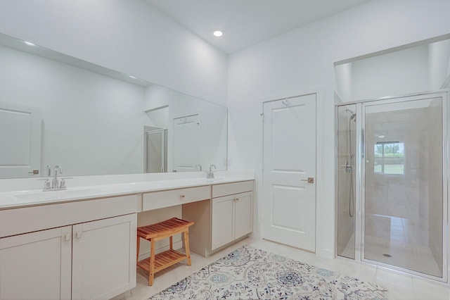 19579 Weathervane Way, The Acreage, FL 33470 - full bathroom featuring a stall shower, double vanity, tile patterned floors, and recessed lighting