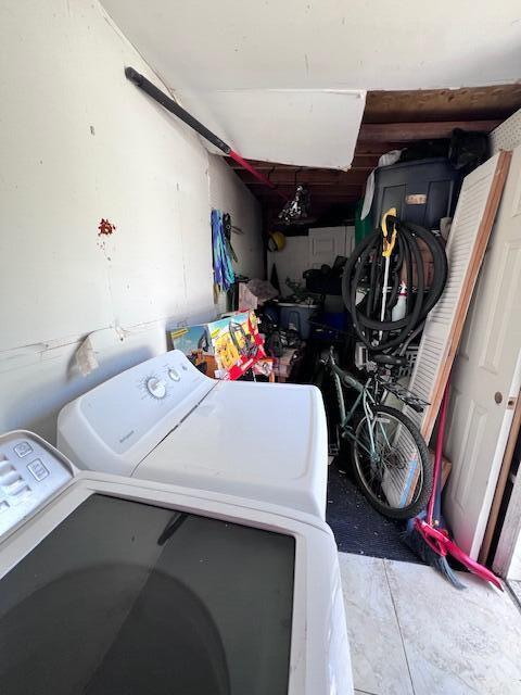 4928 Jefferson Rd, Delray Beach, FL 33445 - laundry room with washer and clothes dryer