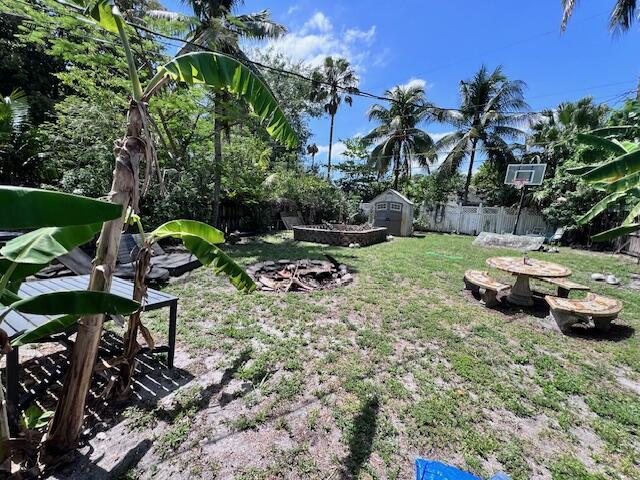 4928 Jefferson Rd, Delray Beach, FL 33445 - view of yard with a storage unit and an outdoor structure