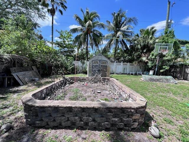 4928 Jefferson Rd, Delray Beach, FL 33445 - view of yard with a storage unit and an outdoor structure