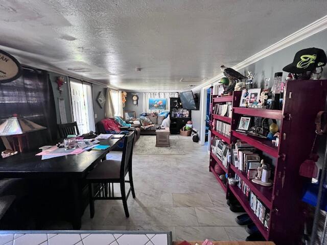 4928 Jefferson Rd, Delray Beach, FL 33445 - dining space featuring a textured ceiling
