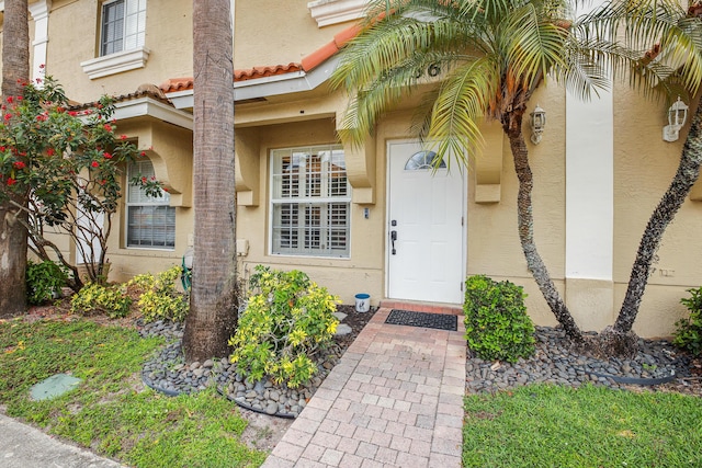 6936 Stoney Creek Cir, Lake Worth, FL 33467 - doorway to property with stucco siding