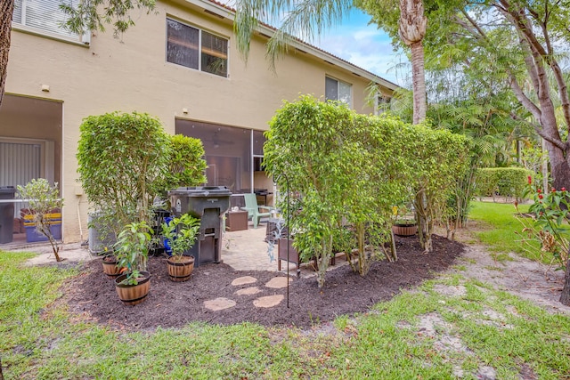 6936 Stoney Creek Cir, Lake Worth, FL 33467 - rear view of house featuring stucco siding and a patio