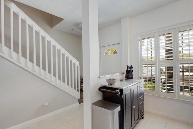 6936 Stoney Creek Cir, Lake Worth, FL 33467 - interior space with stairs, light tile patterned flooring, and baseboards