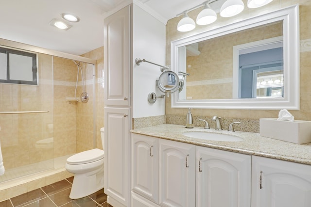 full bathroom featuring tile patterned flooring, toilet, a stall shower, and vanity