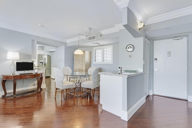 kitchen with stainless steel refrigerator with ice dispenser, ornamental molding, hardwood / wood-style floors, and white cabinetry