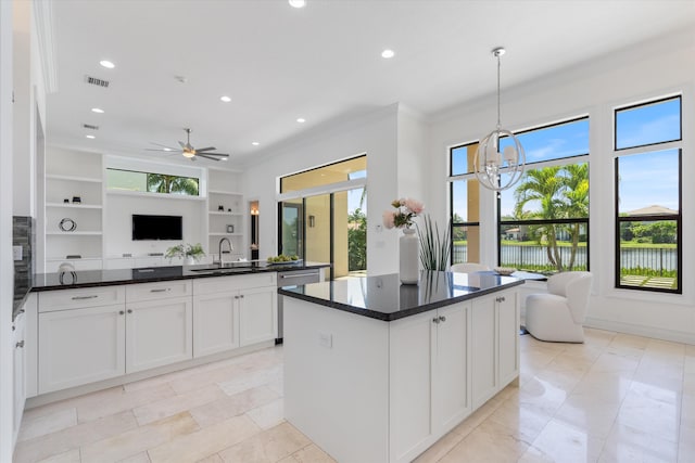 kitchen featuring a sink, open floor plan, dishwasher, plenty of natural light, and recessed lighting
