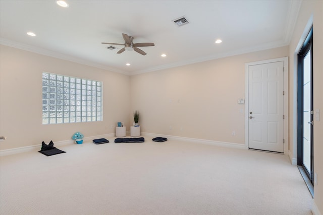 workout room with light carpet, ceiling fan, plenty of natural light, recessed lighting, and crown molding