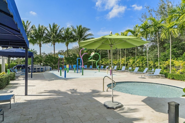 community pool featuring a gazebo and a patio