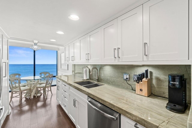 250 S Ocean Blvd Unit 2H, Boca Raton, FL 33432 - kitchen featuring stainless steel dishwasher, a sink, white cabinetry, recessed lighting, and expansive windows