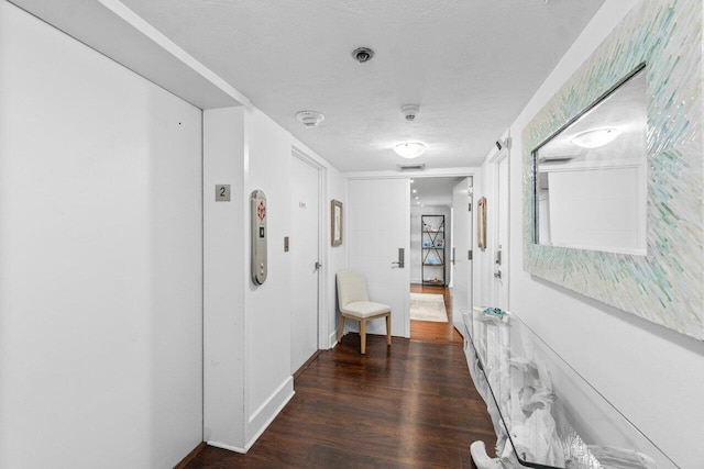 250 S Ocean Blvd Unit 2H, Boca Raton, FL 33432 - corridor featuring wood finished floors and a textured ceiling