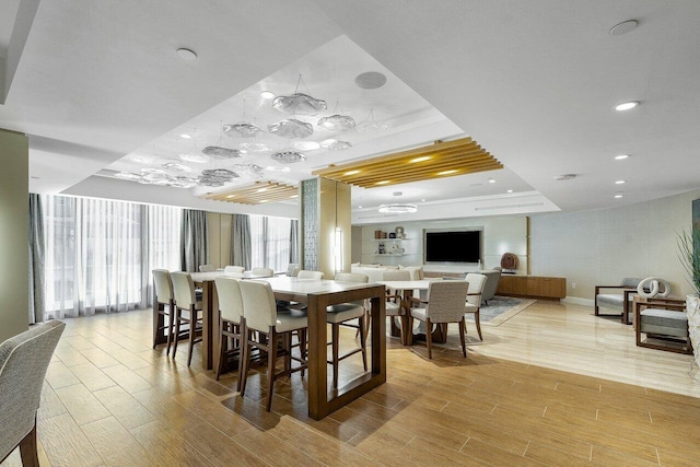 250 S Ocean Blvd Unit 2H, Boca Raton, FL 33432 - dining room featuring a tray ceiling, light wood-style floors, recessed lighting, and baseboards