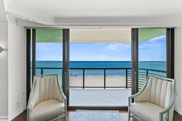 250 S Ocean Blvd Unit 2H, Boca Raton, FL 33432 - sitting room featuring wood finished floors, view of water and beach, and baseboards