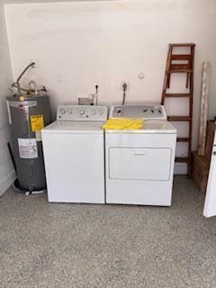 21 Walcott Dr, Boynton Beach, FL 33426 - clothes washing area with washer and dryer and water heater