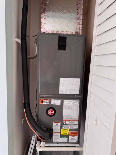 21 Walcott Dr, Boynton Beach, FL 33426 - utility room featuring heating unit