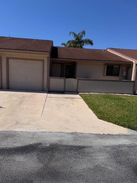 21 Walcott Dr, Boynton Beach, FL 33426 - single story home featuring concrete driveway, a garage, and stucco siding