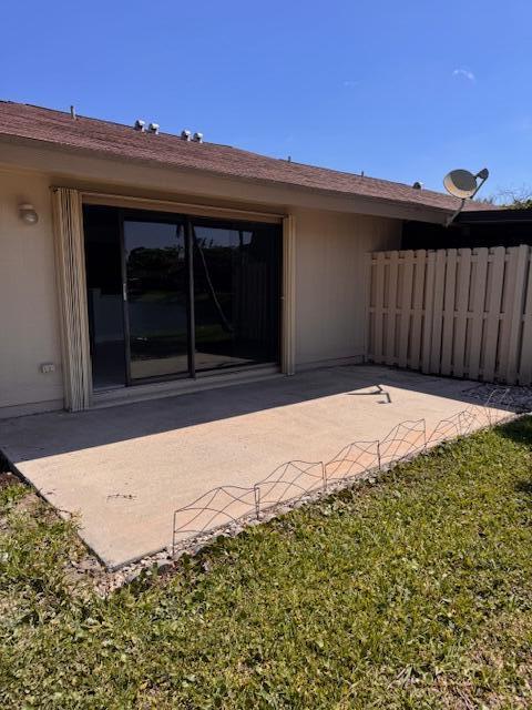 21 Walcott Dr, Boynton Beach, FL 33426 - back of house with a patio area and fence