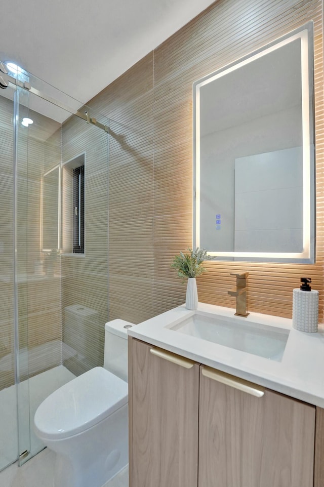 2924 NW 6th Ave, Wilton Manors, FL 33311 - bathroom featuring tile walls, vanity, a shower stall, and toilet