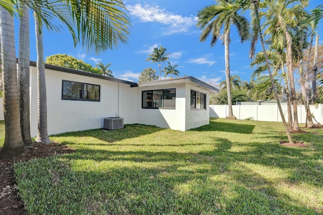 2924 NW 6th Ave, Wilton Manors, FL 33311 - back of property featuring stucco siding and central AC