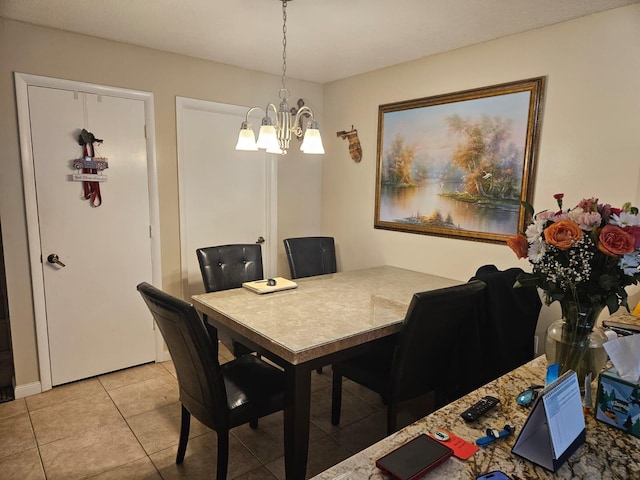 24 Bedford Ct Unit A, Royal Palm Beach, FL 33411 - dining area with a chandelier and light tile patterned floors