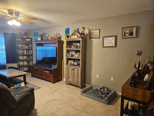 24 Bedford Ct Unit A, Royal Palm Beach, FL 33411 - living area with light tile patterned floors, a textured ceiling, and ceiling fan