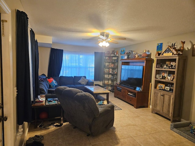 24 Bedford Ct Unit A, Royal Palm Beach, FL 33411 - living area with light tile patterned floors, ceiling fan, and a textured ceiling