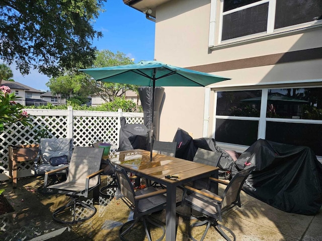 24 Bedford Ct Unit A, Royal Palm Beach, FL 33411 - view of patio / terrace with outdoor dining area
