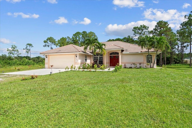 16931 N 78th Rd N, The Acreage, FL 33470 - mediterranean / spanish house featuring a tile roof, stucco siding, a front lawn, driveway, and an attached garage
