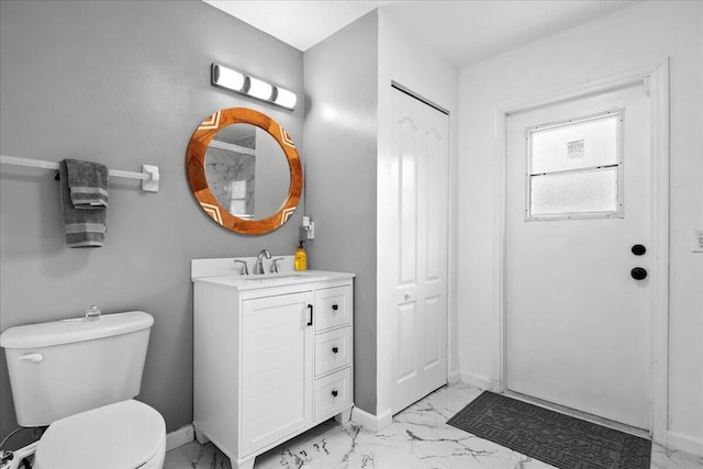 16931 N 78th Rd N, The Acreage, FL 33470 - bathroom featuring marble finish floors, toilet, vanity, and baseboards