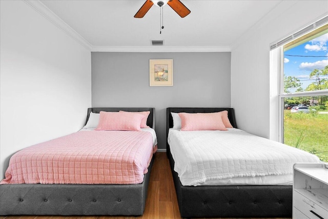 16931 N 78th Rd N, The Acreage, FL 33470 - bedroom with wood finished floors, ornamental molding, and a ceiling fan