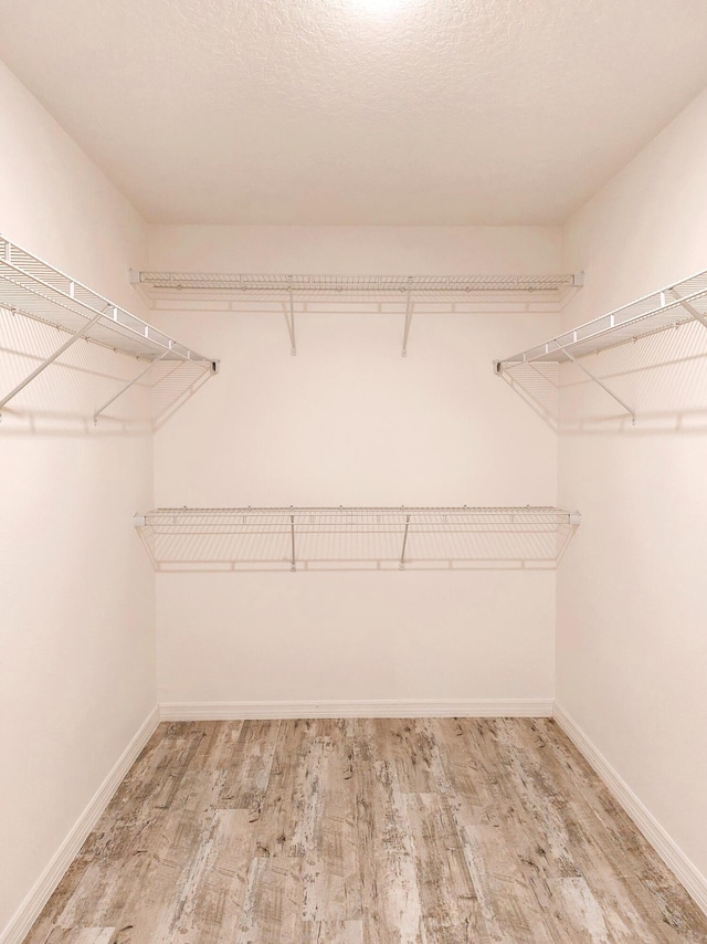 1614 SW Sylvester Ln, Port Saint Lucie, FL 34984 - spacious closet featuring wood finished floors