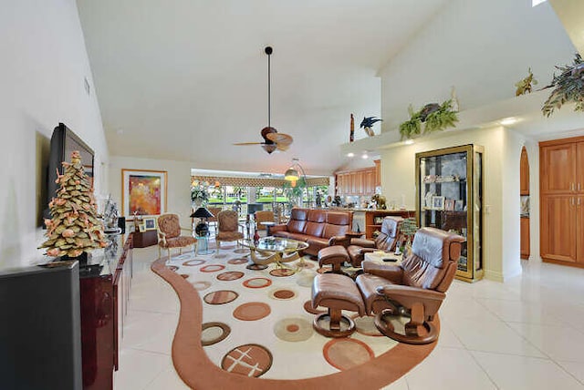 150 Beach Summit Ct, Jupiter, FL 33477 - living area with high vaulted ceiling, light tile patterned floors, ceiling fan, and arched walkways