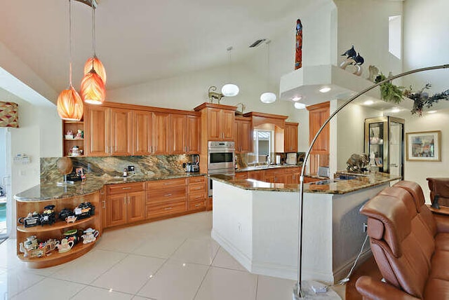 150 Beach Summit Ct, Jupiter, FL 33477 - kitchen featuring open shelves, stainless steel double oven, brown cabinetry, backsplash, and a peninsula